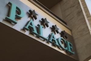 a sign on the side of a building at Laguna Palace Hotel Grado in Grado +78 photos