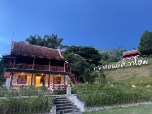 a house on a hill next to a river at Pupha&Sila Home Resort in Betong