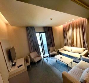 a living room with a couch and a table at Rawsheh Boutique Hotel in Beirut