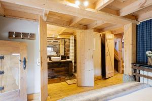 a room with wooden walls and wooden floors at Cabañas con Encanto in San Roque de Ríomiera +214 photos