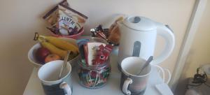 a counter with cups and a blender and some food at Rooms by the Lade Braes & Doocot in St Andrews in St. Andrews +32 photos