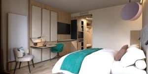 a bedroom with a bed and a table and a kitchen at 1A Landhotel Schicklberg in Kremsmünster