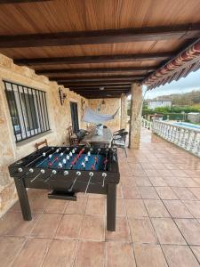 a ping pong table sitting on a patio at Castillo Valmoral in Burgos