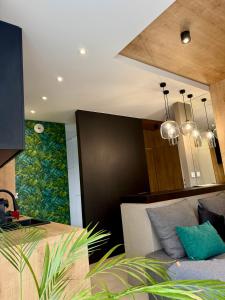 a living room with a couch and a dining room at ALEKSANDRA 5 - Leaf in Kielce