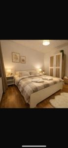a bedroom with a large bed in a room at Les Lilas in Marche-en-Famenne