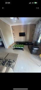 a room with a bed and a tv on the wall at Sefitel in Lubumbashi