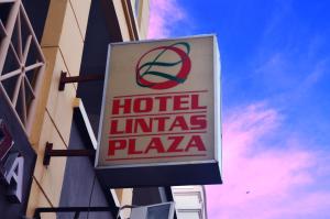 a sign for a hotel illinois plaza on the side of a building at Lintas Plaza Hotel in Kota Kinabalu