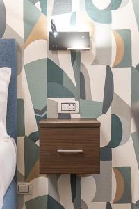 a table with a scale on top of it in a bedroom at Maison dei Greci in Rome +51 photos