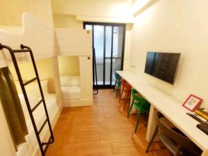 a room with a desk and a bunk bed at Donghae13.8 in Longjing +31 photos