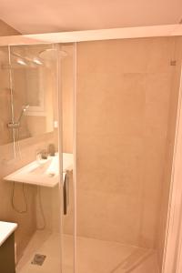 a bathroom with a shower and a sink at Brand New! Fresh Kolonaki Studio in Athens