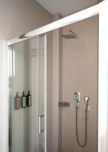 a shower in a bathroom with a glass shower stall at EV 11 Athens in Athens +56 photos