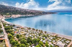 an aerial view of a beach next to a body of water at Camping Baska in Krk +6 photos