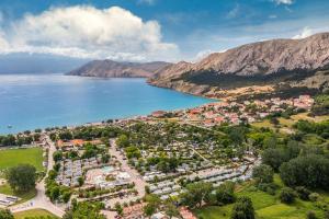 an aerial view of a town next to a body of water at Camping Baska in Krk