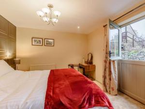 a bedroom with a large bed and a window at 1 Bed in Stoke-on-trent oc-89733 in Waterhouses