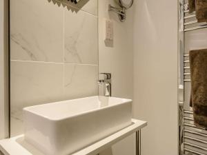 a bathroom with a white sink and a mirror at 1 Bed in Stoke-on-trent oc-89733 in Waterhouses +11 photos