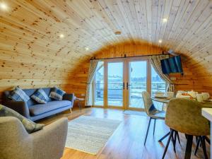 a living room with a couch and a table at 2 Bed in Rhayader oc-90274 in Saint Harmon