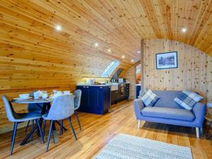 a room with a table and chairs and a kitchen at 2 Bed in Rhayader oc-90274 in Saint Harmon