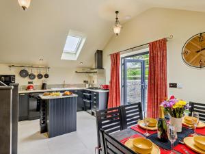 a kitchen with a table and chairs and a clock on the wall at 2 Bed in Stoke-on-trent oc-94790 in Waterhouses +17 photos