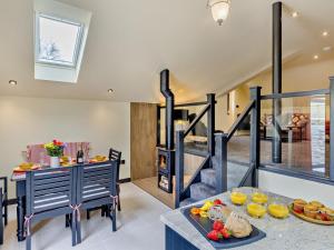 a kitchen and dining room with a table with food at 2 Bed in Stoke-on-trent oc-94790 in Waterhouses