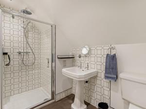 a white bathroom with a sink and a shower at 2 Bed in Stoke-on-trent oc-94790 in Waterhouses