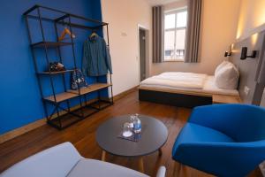a room with a bed and a table and a chair at Gutshof Vogt in Geismar