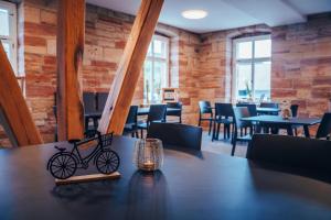 a bike toy sitting on a table in a restaurant at Gutshof Vogt in Geismar