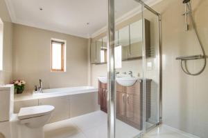 a bathroom with a shower and a toilet and a sink at 3 Bed in Walberswick oc-htroy2 in Walberswick +15 photos