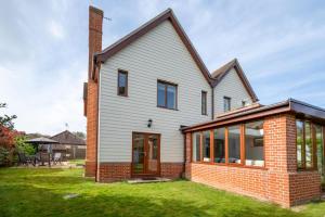 a house with a brick and glass extension at 3 Bed in Walberswick oc-htroy2 in Walberswick