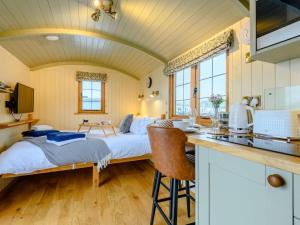 a bedroom with a bed in the middle of a room at 1 Bed in Rhayader oc-90284 in Saint Harmon