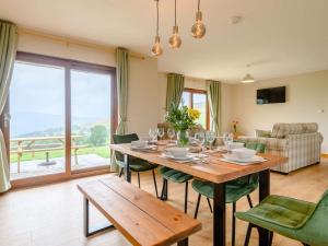 a dining room with a table and chairs with a view at 2 Bed in Llandrindod Wells oc-89063 in Nantmel