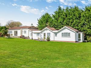 a white house with a large yard at 2 Bed in Bristol oc-05135 in Chew Magna