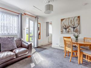 a living room with a couch and a table at 2 Bed in Bristol oc-05135 in Chew Magna