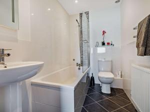 a white bathroom with a sink and a toilet at 3 Bed in Watchet oc-83532 in Watchet +10 photos
