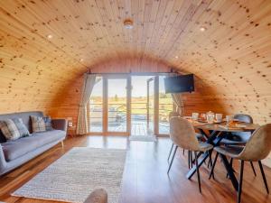 a living room with a table and a couch at 2 Bed in Rhayader oc-90280 in Saint Harmon +13 photos