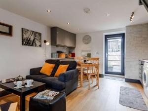 a living room with a couch and a table at 1 Bed in Brecon oc-bn034 in Cray