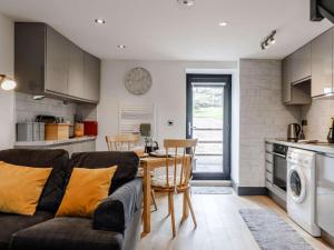 a kitchen and living room with a couch and a table at 1 Bed in Brecon oc-bn034 in Cray +12 photos