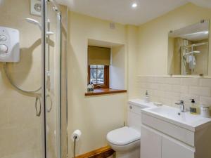 a bathroom with a shower and a toilet and a sink at 4 Bed in Abergavenny oc-88014 in Llanover +31 photos