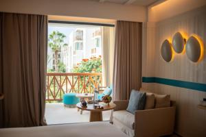 a hotel room with a bed and a balcony at The View Agadir in Agadir +80 photos