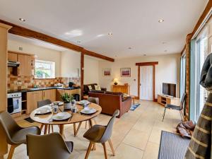 a kitchen and living room with a table and chairs at 2 Bed in Doncaster oc-93150 in Mattersey