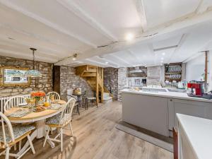 a kitchen and dining room with a table and chairs at 2 Bed in Brecon oc-92729 in Brecon