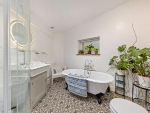 a bathroom with a tub and a sink at 2 Bed in Brecon oc-92729 in Brecon +31 photos