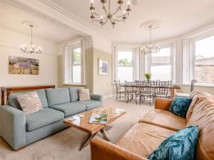 a living room with a couch and a table at 4 Bed in Matlock oc-88011 in Matlock