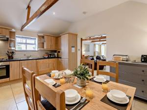 a kitchen and dining room with a table and chairs at 3 Bed in Doncaster oc-91307 in Mattersey