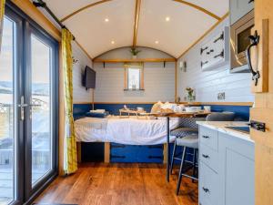 a bedroom in a tiny house with a bed at 1 Bed in Rhayader oc-90278 in Saint Harmon