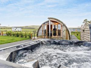 a large hot tub in the backyard of a house at 2 Bed in Rhayader oc-90276 in Saint Harmon