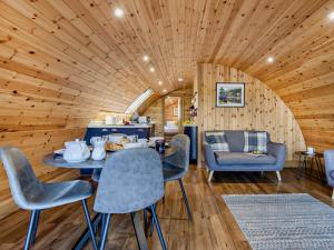 a room with a table and chairs in a cabin at 2 Bed in Rhayader oc-90276 in Saint Harmon