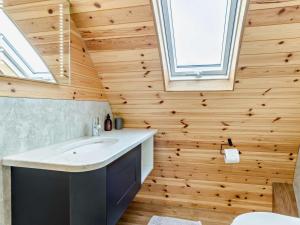 a bathroom with a sink and a wooden wall at 2 Bed in Rhayader oc-90276 in Saint Harmon +18 photos