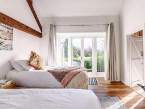 a bedroom with two beds and a window at 2 Bed in Chippenham oc-77333 in Chippenham