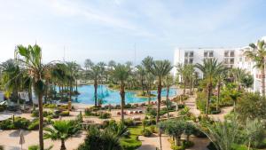 a view of a resort with palm trees and a pool at The View Agadir in Agadir