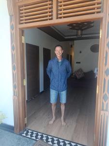 a man standing in the doorway of a room at Horizon Guest Hatton in Hatton